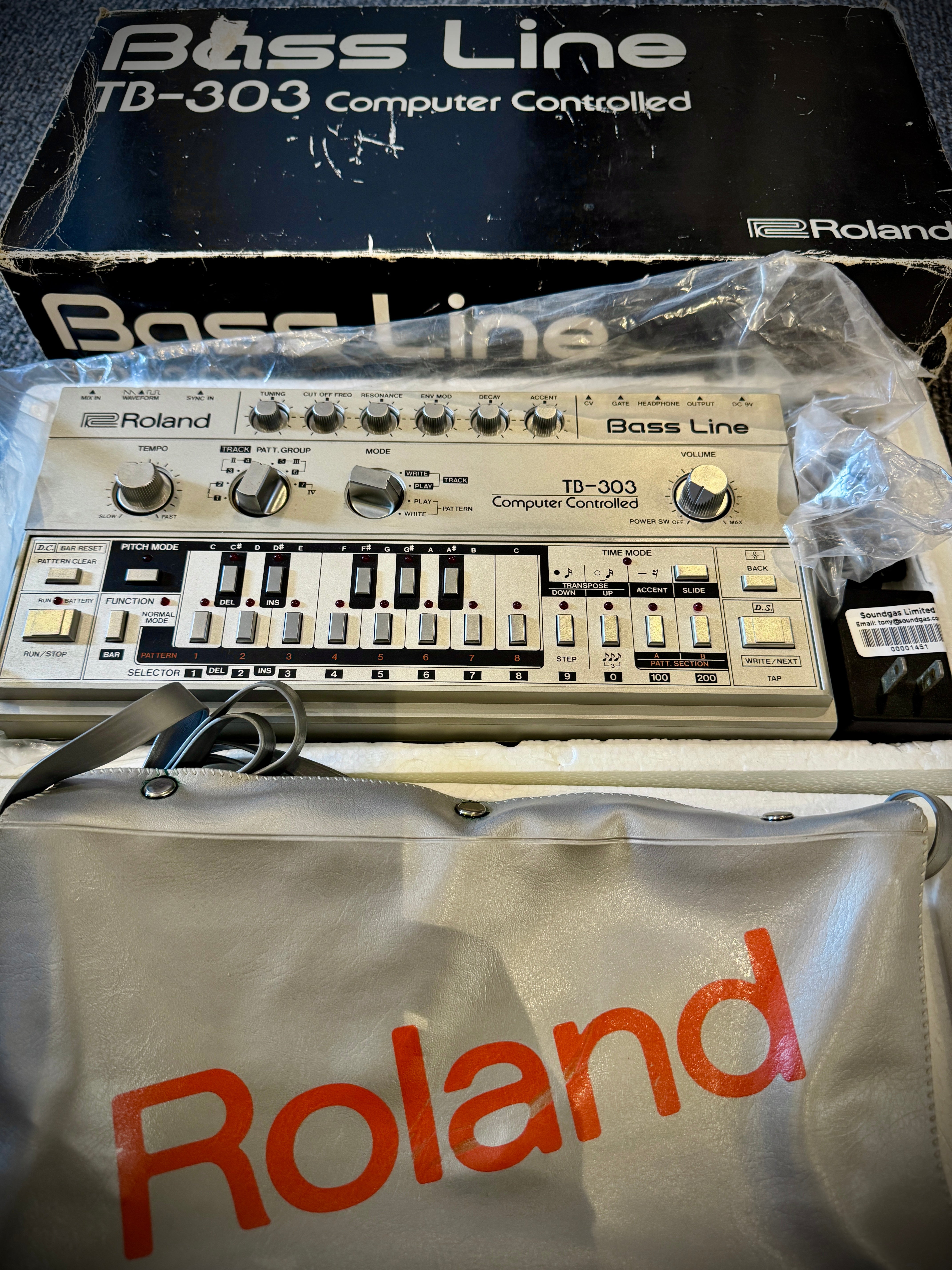 Roland TB-303 synthesizer with packaging and Roland bag