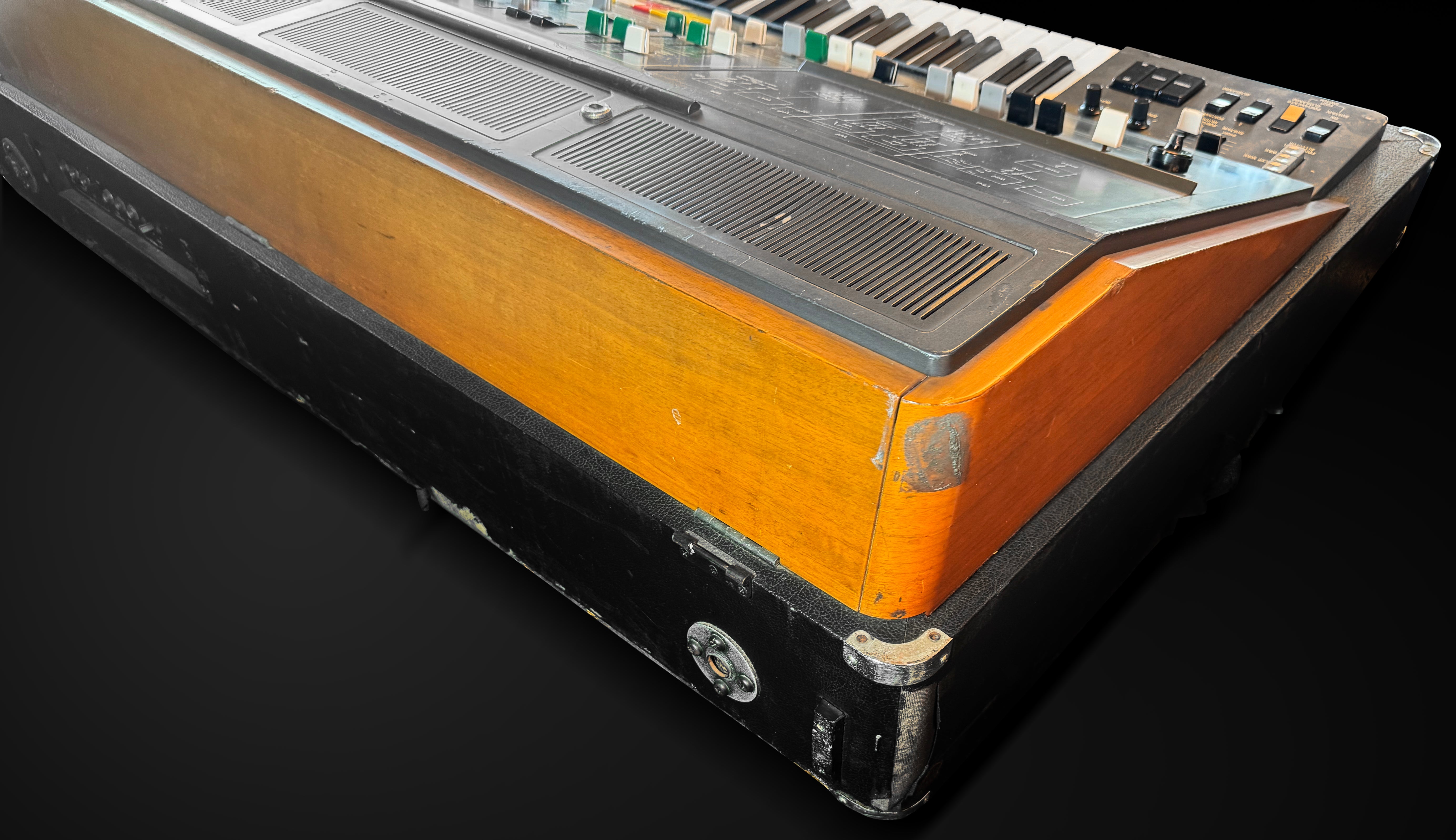 Vintage electronic keyboard on a black background